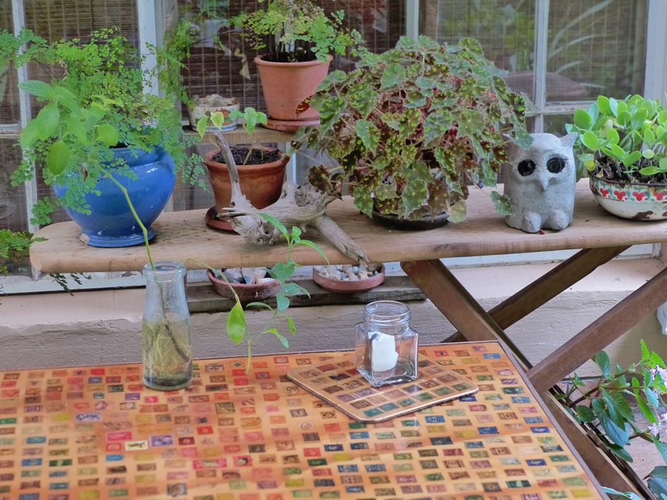 Repurposed ironing board and postage stamps