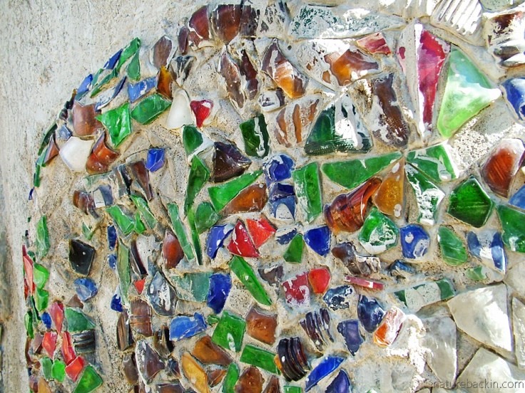 Glass fragments embedded in concrete embellish a sculpture at Helen Martins' Owl House, South Africa