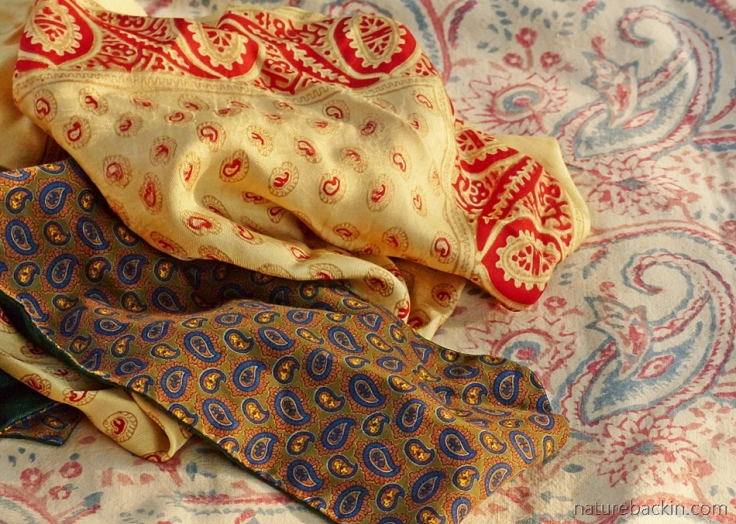 Paisley pattern on cravat, silk pocket square and block-printed cotten
