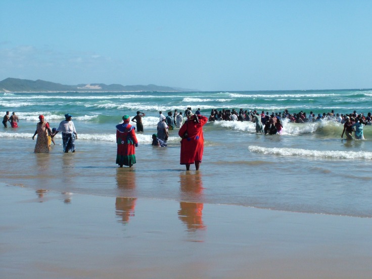 African Zionist church group entering the sea at Sodwana Bay, KwaZulu-Natal